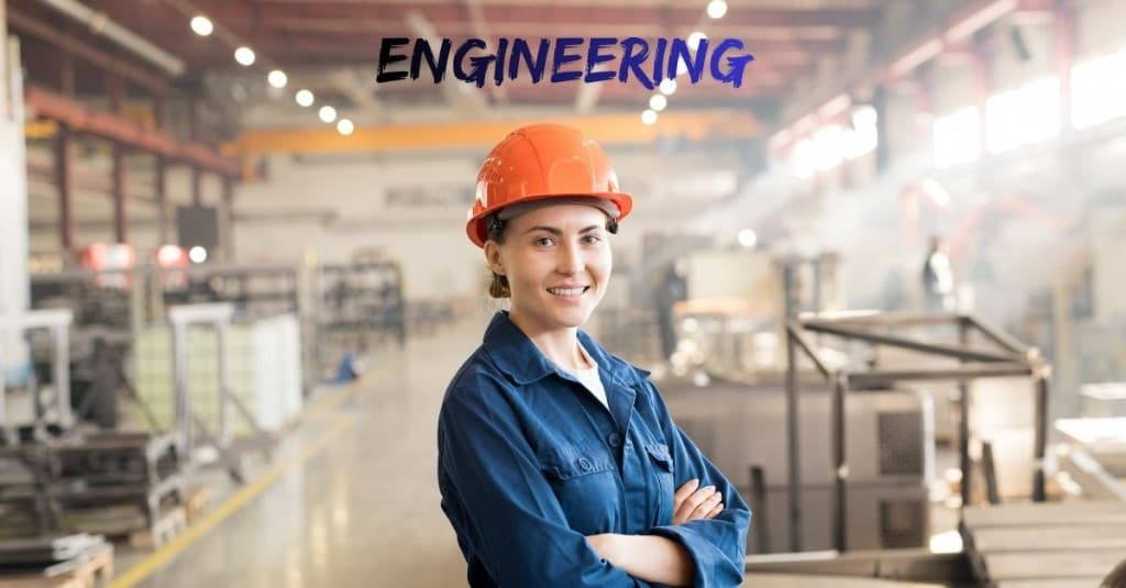 Engineering-themed flat lay: hard hat, tools, blueprints and laptop on technical drawings